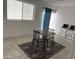 A bright and airy living room with a rug and a dining table at 4602 N 47Th N Ave, Phoenix, AZ 85031