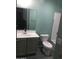 Cozy bathroom with a modern vanity, toilet and shower/bath combination at 4722 S 238Th Ln, Buckeye, AZ 85326
