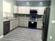 Well-lit kitchen with stainless steel appliances and light cabinets at 4722 S 238Th Ln, Buckeye, AZ 85326
