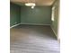 Open-concept living room with sleek floors and large window for natural light at 4722 S 238Th Ln, Buckeye, AZ 85326