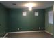 Spacious living room with three windows, modern ceiling fan and neutral paint perfect for relaxation at 4722 S 238Th Ln, Buckeye, AZ 85326