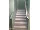 Stairway with wood-look steps and white risers and railings at 4722 S 238Th Ln, Buckeye, AZ 85326