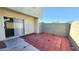 Private patio with red concrete pavers, block fencing, and a sliding glass door to the home at 4752 W Palo Verde Dr, Glendale, AZ 85301