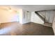 Open concept living room featuring neutral paint, ceiling fan and tile flooring and a staircase at 4752 W Palo Verde Dr, Glendale, AZ 85301