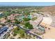 Stunning aerial view showcasing resort amenities including multiple pools, lush landscaping, and elegant buildings at 4849 N Camelback Ridge Rd # B403, Scottsdale, AZ 85251