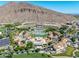 Stunning aerial view of a resort featuring pools, villas, golf course, and mountain backdrop at 4849 N Camelback Ridge Rd # B403, Scottsdale, AZ 85251
