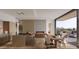 Bright and airy living space with modern fireplace, island, and dining area flowing to an outdoor patio at 4849 N Camelback Ridge Rd # B403, Scottsdale, AZ 85251