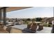 Expansive outdoor patio with comfortable seating, dining, and scenic mountain views at 4849 N Camelback Ridge Rd # B403, Scottsdale, AZ 85251