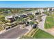 Street view of modern homes in a golf course community lined with palm trees and green landscapes at 4849 N Camelback Ridge Rd # B403, Scottsdale, AZ 85251
