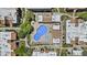 Aerial view of the community pool and surrounding buildings and landscaping at 5525 E Thomas Rd # K16, Phoenix, AZ 85018