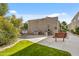Well-maintained community grill area with ample seating and lush landscaping for outdoor enjoyment at 5525 E Thomas Rd # K16, Phoenix, AZ 85018