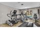 Community fitness center with modern equipment and a view of the sparkling swimming pool at 5525 E Thomas Rd # K16, Phoenix, AZ 85018