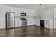 Bright kitchen with white cabinetry, stainless appliances and pendant lighting above the sink at 5525 E Thomas Rd # K16, Phoenix, AZ 85018