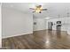 Open living space with hardwood floors, modern ceiling fan and eat-in kitchen at 5525 E Thomas Rd # K16, Phoenix, AZ 85018