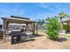 Enjoy outdoor grilling under a covered gazebo in this backyard, overlooking the refreshing pool at 5615 W Camelback Rd, Phoenix, AZ 85031