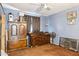 Bedroom featuring a large wardrobe, dresser, and vintage decor, offering ample storage and a nostalgic ambiance at 5615 W Camelback Rd, Phoenix, AZ 85031