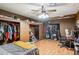 Cozy bedroom with hardwood floors, featuring ample closet space and a dedicated study area for work or hobbies at 5615 W Camelback Rd, Phoenix, AZ 85031