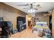 Comfortable bedroom with a built-in fireplace, offering a relaxing retreat with a convenient TV setup and casual seating at 5615 W Camelback Rd, Phoenix, AZ 85031