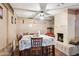 Inviting dining room features a fireplace and seating for eight, perfect for Gathering meals and gatherings at 5615 W Camelback Rd, Phoenix, AZ 85031