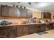 Spacious kitchen featuring dark wood cabinetry, offering ample storage space and counter area at 5615 W Camelback Rd, Phoenix, AZ 85031