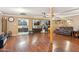 Spacious living room with wood floors, seamless connection to the kitchen, and comfortable seating at 5615 W Camelback Rd, Phoenix, AZ 85031