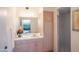 Well-lit bathroom featuring wood cabinets, a shower, and neutral decor at 5921 E Leisure Ln, Carefree, AZ 85377
