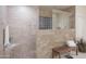 Modern bathroom with a walk-in shower featuring beautiful tile work, a built-in bench, and contemporary fixtures at 5921 E Leisure Ln, Carefree, AZ 85377