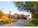 Expansive property with Southwestern architecture, desert flora, and a generous driveway at 5921 E Leisure Ln, Carefree, AZ 85377