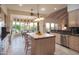 Bright kitchen with stainless appliances, tile floors, a wooden island, and a breakfast nook with backyard views at 5921 E Leisure Ln, Carefree, AZ 85377