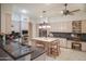 Spacious kitchen featuring stainless steel appliances, granite counters, and a large wooden island with seating at 5921 E Leisure Ln, Carefree, AZ 85377