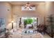 Bright living room with high ceilings, french doors to the patio, a piano, and comfortable seating at 5921 E Leisure Ln, Carefree, AZ 85377