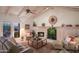 Cozy living room with a fireplace, comfortable seating, and access to the outdoor area at 5921 E Leisure Ln, Carefree, AZ 85377
