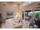 Elegant living room featuring a vaulted ceiling, hardwood floors, and open access to the patio at 5921 E Leisure Ln, Carefree, AZ 85377