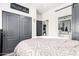 Comfortable bedroom with a sliding barn door leading to the bathroom at 597 S 221St Dr, Buckeye, AZ 85326