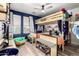 bedroom with bunk beds, toy storage, and natural light at 597 S 221St Dr, Buckeye, AZ 85326