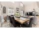 Open-concept living and dining area with high ceilings and lots of natural light at 597 S 221St Dr, Buckeye, AZ 85326