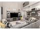 Stylish living room with a large sectional sofa, media center, and modern accents at 597 S 221St Dr, Buckeye, AZ 85326