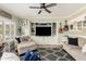 Inviting living room with built-in entertainment center and stylish decor, ideal for relaxing and entertaining guests at 597 S 221St Dr, Buckeye, AZ 85326