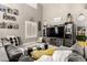 Comfortable living room with modern decor, fireplace, and a cozy atmosphere at 597 S 221St Dr, Buckeye, AZ 85326