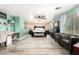Spacious main bedroom with wood-look accent wall, ample natural light, and an attached seating area at 597 S 221St Dr, Buckeye, AZ 85326