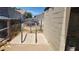 A cement access point with metal bars next to a concrete block shed at 6104 W Marconi Ave, Glendale, AZ 85306
