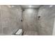 Updated bathroom with tiled walk-in shower, decorative tile floor, and modern fixtures at 6104 W Marconi Ave, Glendale, AZ 85306