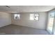 Well-lit bedroom with tiled flooring and a glass sliding door at 6104 W Marconi Ave, Glendale, AZ 85306