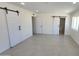 Large bedroom with tile floors, sliding doors, recessed lighting, and neutral walls at 6104 W Marconi Ave, Glendale, AZ 85306