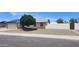 Charming single-story home featuring desert landscaping, a well-kept lawn, and a two car garage at 6104 W Marconi Ave, Glendale, AZ 85306