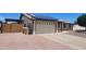 Attached two car garage with solar panels, adjacent to low-maintenance desert landscaping at 6104 W Marconi Ave, Glendale, AZ 85306
