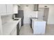 Beautiful kitchen features white cabinetry, stainless steel appliances, and stylish countertops at 6104 W Marconi Ave, Glendale, AZ 85306