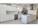 Modern kitchen with white cabinets and stainless steel appliances, plenty of counter space at 6104 W Marconi Ave, Glendale, AZ 85306