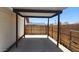 Covered backyard patio with access to the backyard and bordered by fences at 6104 W Marconi Ave, Glendale, AZ 85306