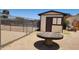 Backyard shed with a side door, window, and chain-link fence at 6104 W Marconi Ave, Glendale, AZ 85306